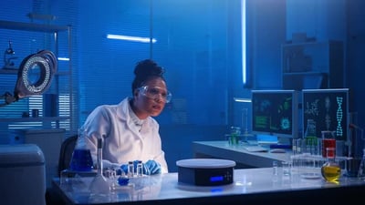 An African American Woman Examines Virtual Graphics Zoomes the Picture.